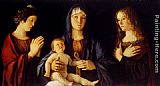 Virgin And Child Between St. Catherine And St. Mary Magdalen by Giovanni Bellini